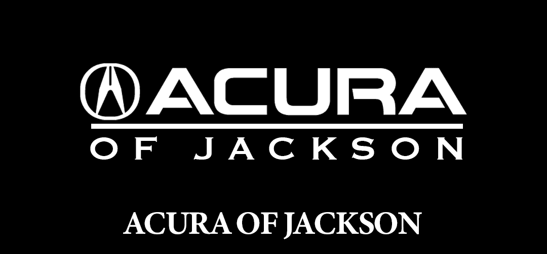 Logo for "Acura of Jackson" in white text on a black background. The logo features the Acura emblem above the text.