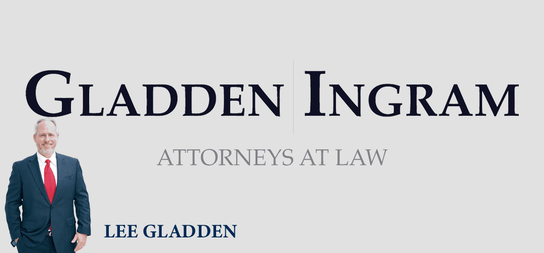 A man in a suit stands next to the text "GLADDEN | INGRAM ATTORNEYS AT LAW" and "LEE GLADDEN" displayed prominently on a light gray background.